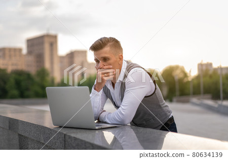 Business. Businessman Using Laptop Outdoors. Modern Technology Concept 80634139