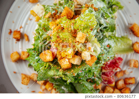 Russian malibu salad with croutons and ham 80636177