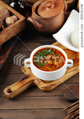 Portion of red mushroom soup 80636196