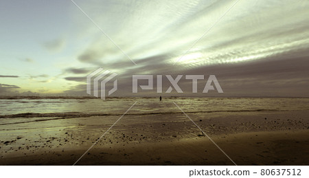 Sunset on Crosby Beach in winter, Crosby, Liverpool, United Kingdom Sunset on Crosby Beach in winter, Crosby, Liverpool, United Kingdom 80637512