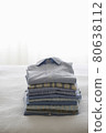 Ironed And Folded Shirts On Bed 80638112