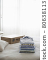 Ironed And Folded Shirts On Bed 80638113