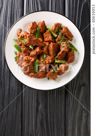 Beef stew Tibs Traditional and Authentic Ethiopian food closeup in the plate. Vertical top view 80639953