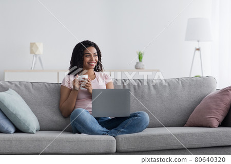 Rest and relax at home with modern device, work at home and coffee break Rest and relax at home with modern device, work at home and coffee break 80640320