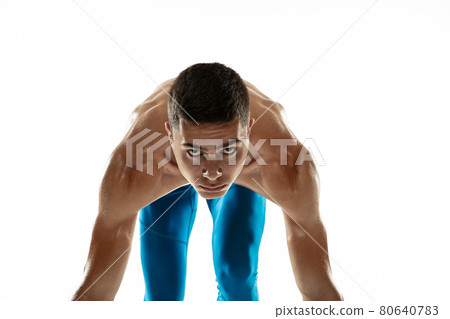 Portrait of young professional male athlete, runner isolated on white studio background. Muscular, sportive man. Concept of sport, healthy lifestyle 80640783