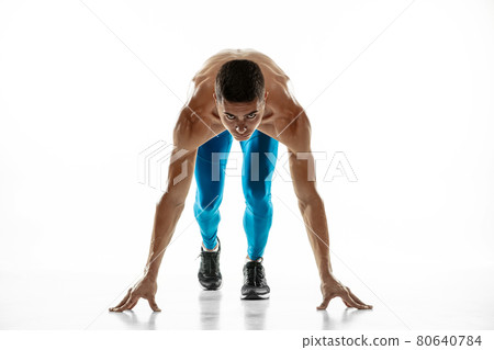 Portrait of young professional male athlete, runner isolated on white studio background. Muscular, sportive man. Concept of sport, healthy lifestyle 80640784