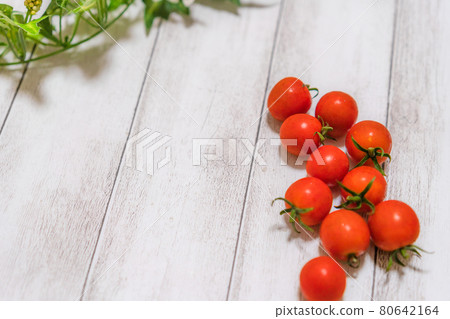 Fresh cherry tomatoes and leaves Fresh cherry tomatoes and leaves 80642164