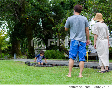 Family enjoying playing in the water Summer 80642306
