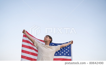 US Independence. Activist with the national flag of America in the sky US Independence. Activist with the national flag of America in the sky 80642490
