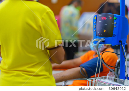 Doctor checking patient arterial blood pressure in hospital. Health care Concept 80642912