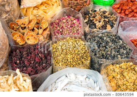 Heaps of tea, dried herbs and grocery at asian street market Heaps of tea, dried herbs and grocery at asian street market 80643594