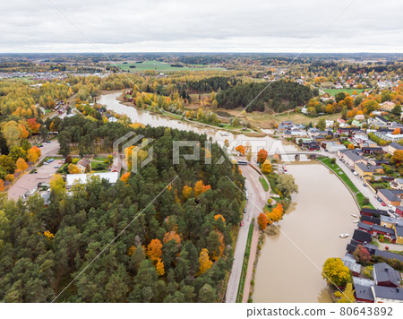 Aerial autumn view of Old town of Porvoo, Finland. Beautiful city landscape with old colorful wooden buildings and river Porvoonjoki. Aerial autumn view of Old town of Porvoo, Finland. Beautiful city landscape with old colorful wooden buildings and river Porvoonjoki. 80643892