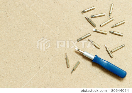 Screwdriver with screw head tip on wood background with copy space Screwdriver with screw head tip on wood background with copy space 80644054