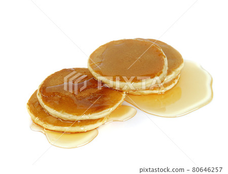 Stack of Pancakes top with honey on white background Stack of Pancakes top with honey on white background 80646257