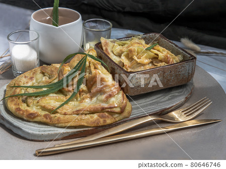 Homemade sweet frying roti (Cannabis Pancake) with Cannabis served with Cannabis tea on ceramic tray. 80646746