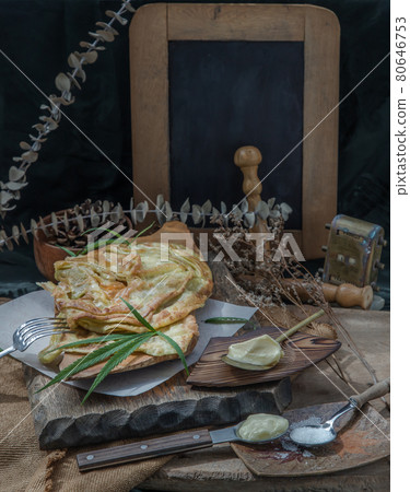 Homemade sweet frying roti (Cannabis Pancake) with cannabis and marijuana leaf on old wooden table. Homemade sweet frying roti (Cannabis Pancake) with cannabis and marijuana leaf on old wooden table. 80646753