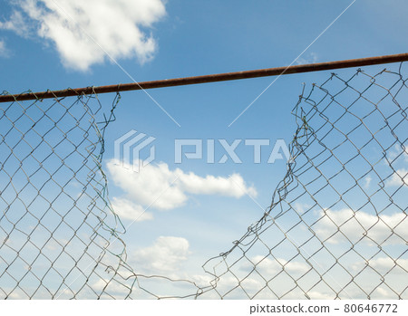 Broken metal mesh fence Broken metal mesh fence 80646772