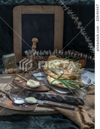 Homemade sweet frying roti (Cannabis Pancake) with cannabis and marijuana leaf on old wooden table. 80646947