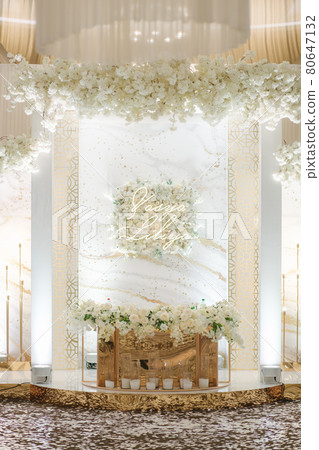 Luxury decoration on wedding table in restaurant. Broom and bride table with natural flowers 80647132