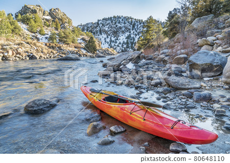 whitewater kayak on river shore whitewater kayak on river shore 80648110