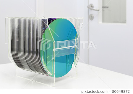 Silicon Wafers in plastic storage box in clear room of semiconductor foundry. 80649872