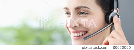 Portrait of smiling woman with headphones and microphone Portrait of smiling woman with headphones and microphone 80650090