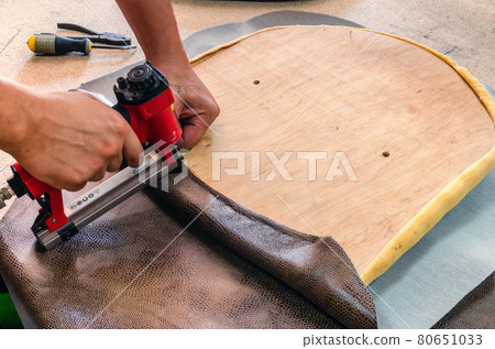 manufacture of upholstered furniture, furniture upholstery with a pneumatic stapler 80651033