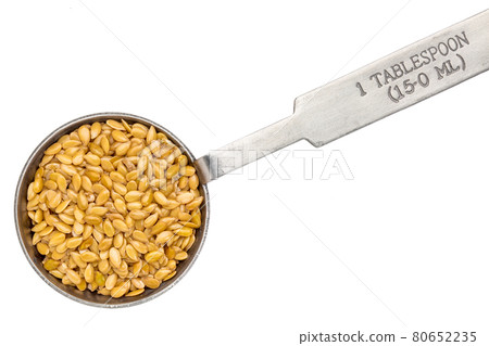 golden flax seed on measuring spoon golden flax seed on measuring spoon 80652235