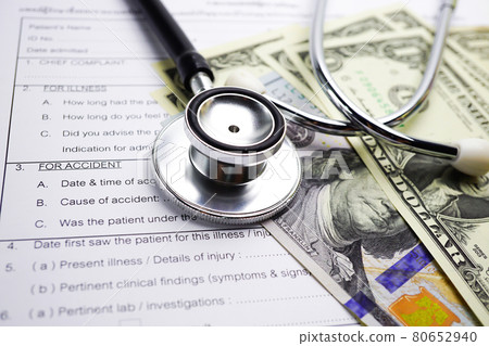 Health insurance accident claim form with stethoscope and US dollar banknotes, Medical concept.    . 80652940