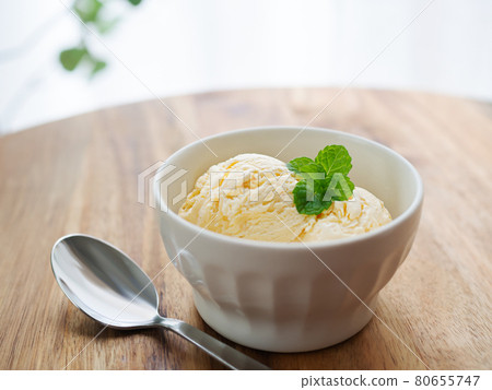 Ice cream placed on the table by the window 80655747