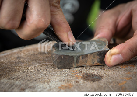 Manual sharpening of forged on a grinding stone. Hand tools 80656498