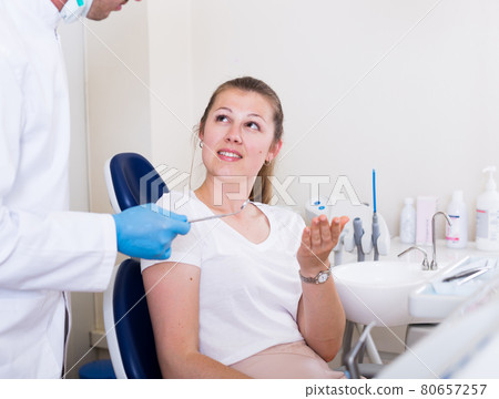 Young woman is talking with doctor 80657257