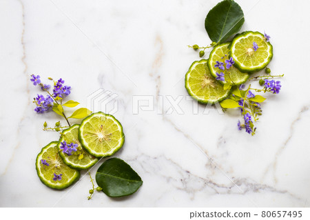 kaffir lime slice herbal medication local flora of asia arrangement flat lay postcard style  80657495