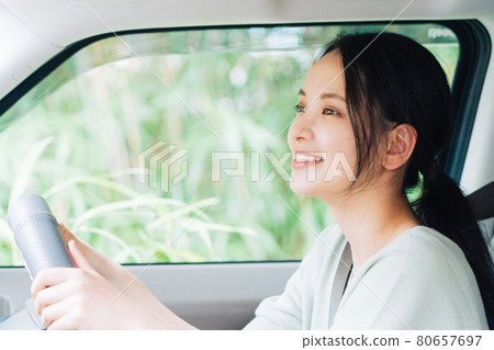 A woman driving a car A woman driving a car 80657697