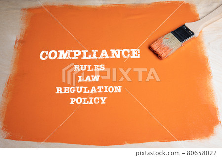 COMPLIANCE concept. Rules, Law, Regulation and Policy. Brush with an orange background 80658022
