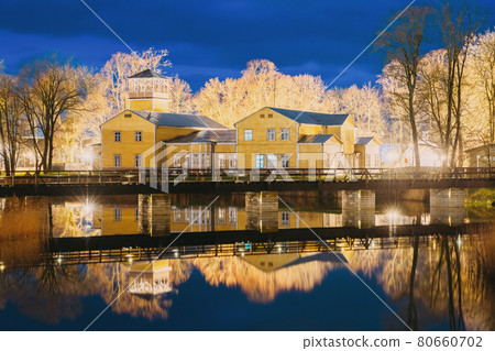 Kuressaare, Estonia. Old Traditional Yellow Wooden House In Evening Blue Hour Night Kuressaare, Estonia. Old Traditional Yellow Wooden House In Evening Blue Hour Night 80660702