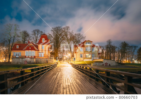 Kuressaare, Estonia. Old Wooden Nobleman's House And Mansion Ekesparre Boutique Hotel In Wooden Art Nouveau In Evening Blue Hour Night Kuressaare, Estonia. Old Wooden Nobleman's House And Mansion Ekesparre Boutique Hotel In Wooden Art Nouveau In Evening Blue Hour Night 80660703