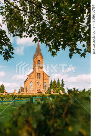 Opsa, Braslav District, Vitebsk Region, Belarus. Church Of St. John The Baptist In Sunny Day Opsa, Braslav District, Vitebsk Region, Belarus. Church Of St. John The Baptist In Sunny Day 80660794