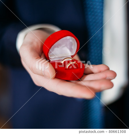 Groom Man Holding Holding Box With Wedding Rings 80661308