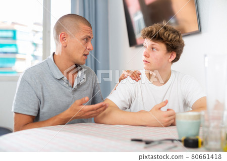 Man with his son are talking about life together at home Man with his son are talking about life together at home 80661418