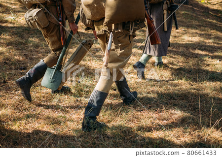 Unidentified re-enactors dressed as Soviet russian soldiers goes along road Unidentified re-enactors dressed as Soviet russian soldiers goes along road 80661433