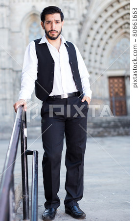 Man standing near iron handrails Man standing near iron handrails 80661663