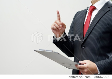 A businessman with a binder 80662028