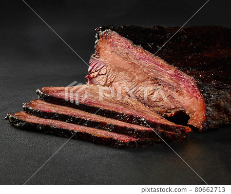 Slices of grilled veal loin in barbecue sauce on gray background Slices of grilled veal loin in barbecue sauce on gray background 80662713