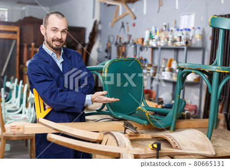 Craftsman in furniture restoration workshop Craftsman in furniture restoration workshop 80665131