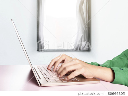 College students typing on a laptop at home College students typing on a laptop at home 80666805