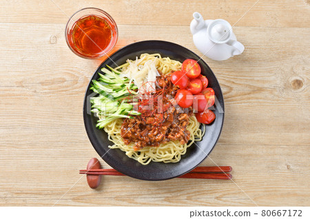 Summer cold noodle dish "Jajar noodles". Put spicy minced meat sauce on boiled and chilled Chinese noodles. Summer cold noodle dish "Jajar noodles". Put spicy minced meat sauce on boiled and chilled Chinese noodles. 80667172