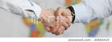Business people handshake on background of world map of world 80668420