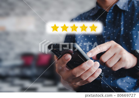 Man hand holding use mobile phone icon Stars Rating 5 star excellent rating or commenting service. Social concept. Man hand holding use mobile phone icon Stars Rating 5 star excellent rating or commenting service. Social concept. 80669727