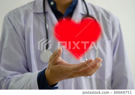 doctor's hand with the red heart icon. Sending encouragement to doctors, nurses and medical personnel 80669751